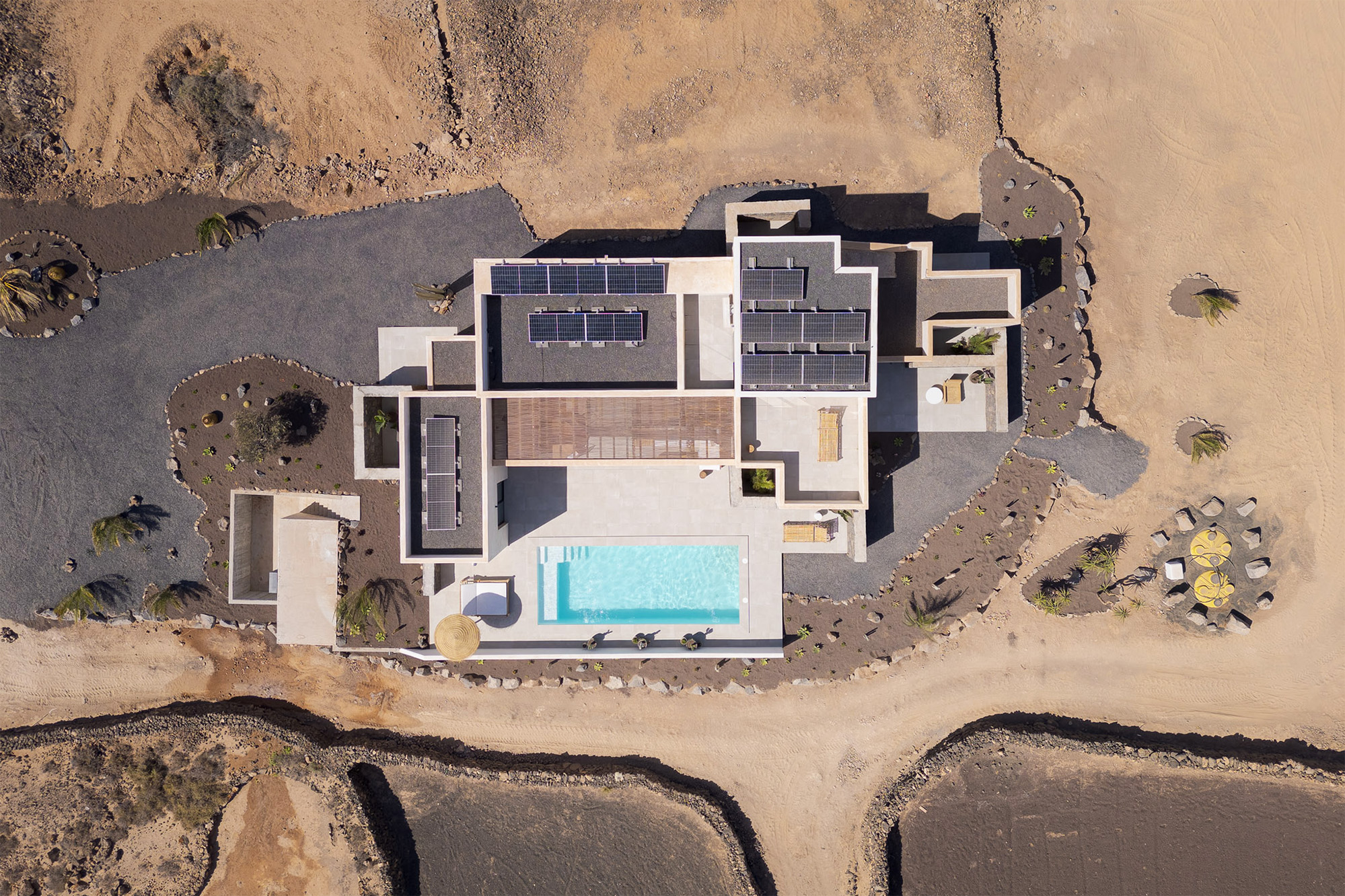 Aerial drone view of Villa Victorina El Roque showing the villa, pool and surrounding Fuerteventura landscape